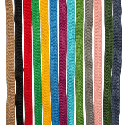 Set of colorful woven straps in various colors on a white background