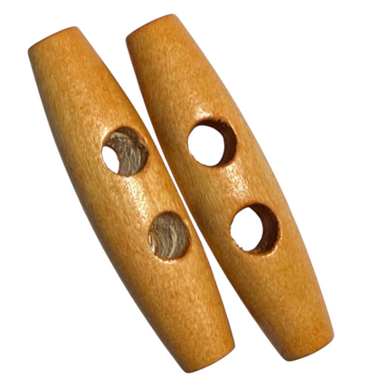 Two light brown wooden beads with two holes, shown on a plain white background.